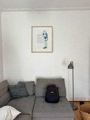 The Man Who Invented Socks in a real frame, on the wall